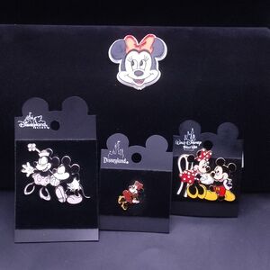 collection of Disney trading pins featuring Mickey and Minnie Mouse.